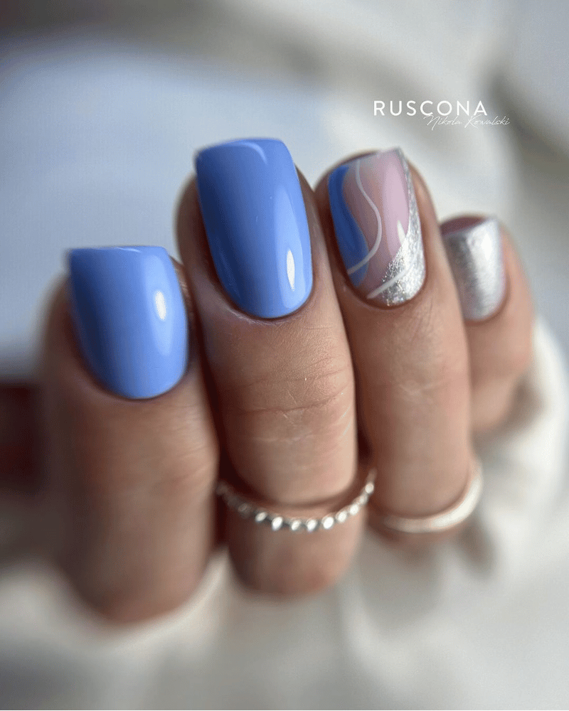 blue manicure with silver accents
