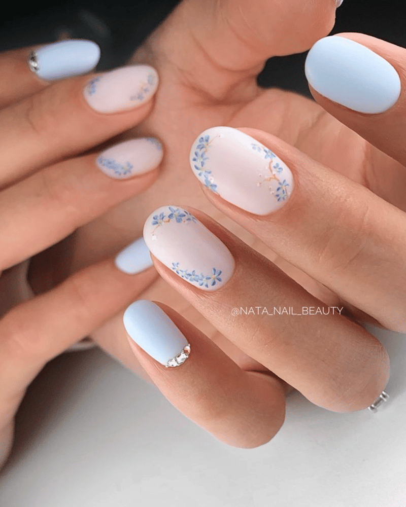 blue nails with blue flowers accent