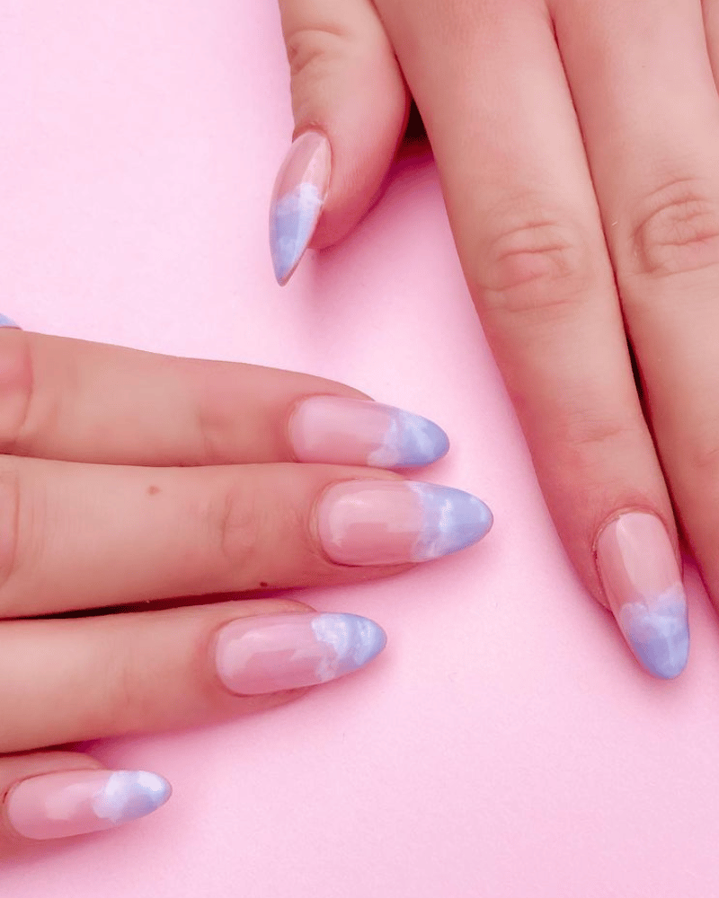 blue nails manicure with clouds
