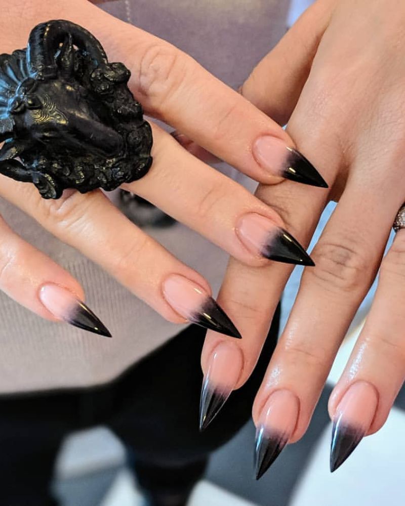 stiletto black nails 
black nails