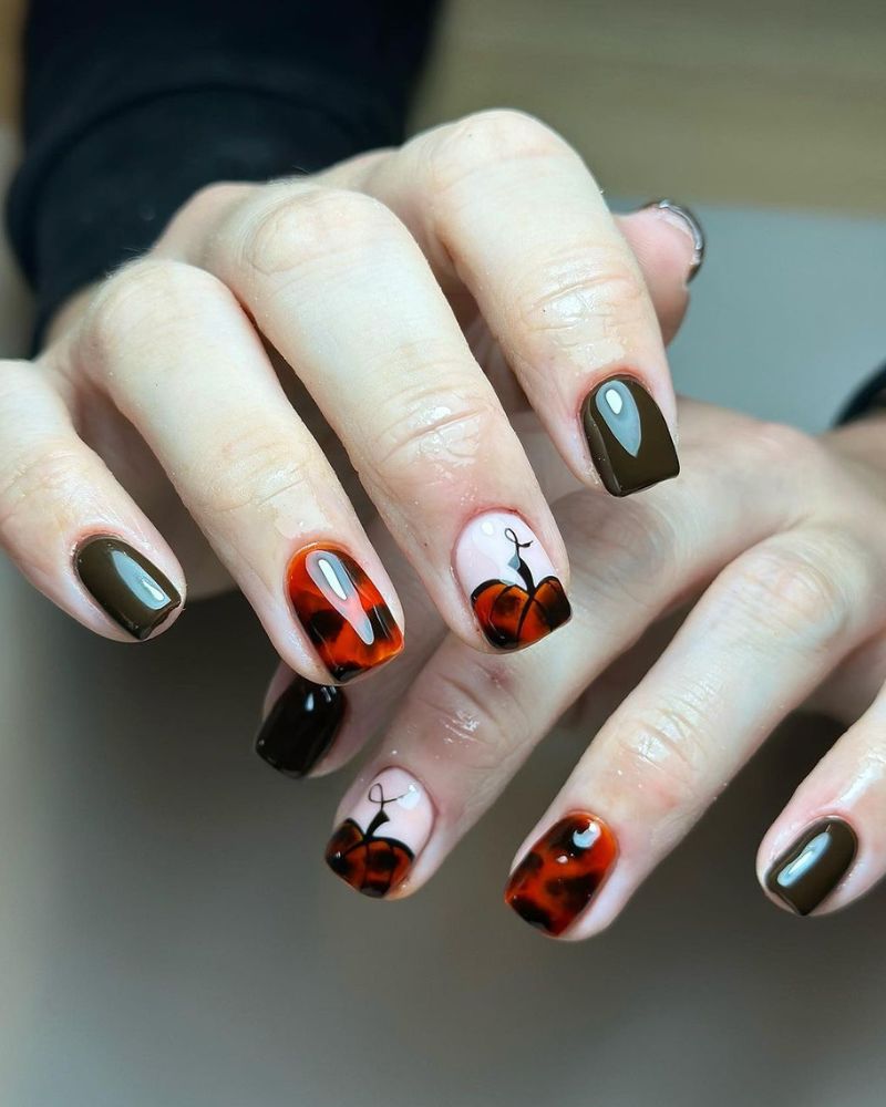 fall nail art with pumpkin