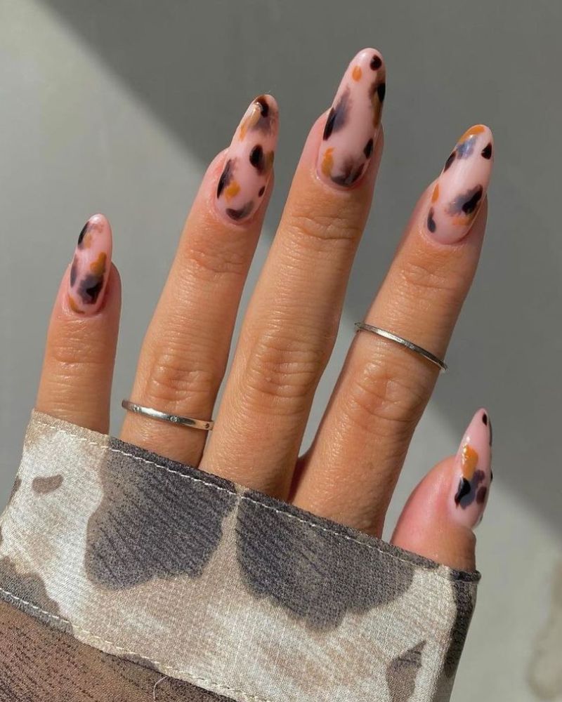 cute fall nail design on a nude manicure