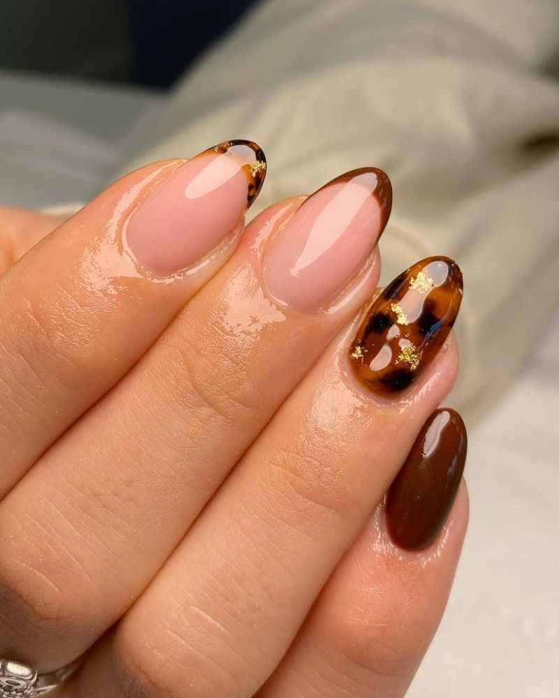 turtoise nail art on brown nails