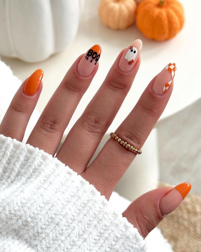 orange fall nails with ghost nail art
