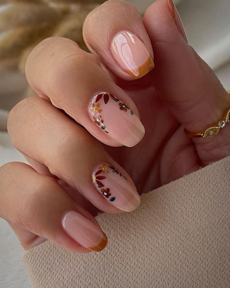 elegant fall nails with french design and floral nail art