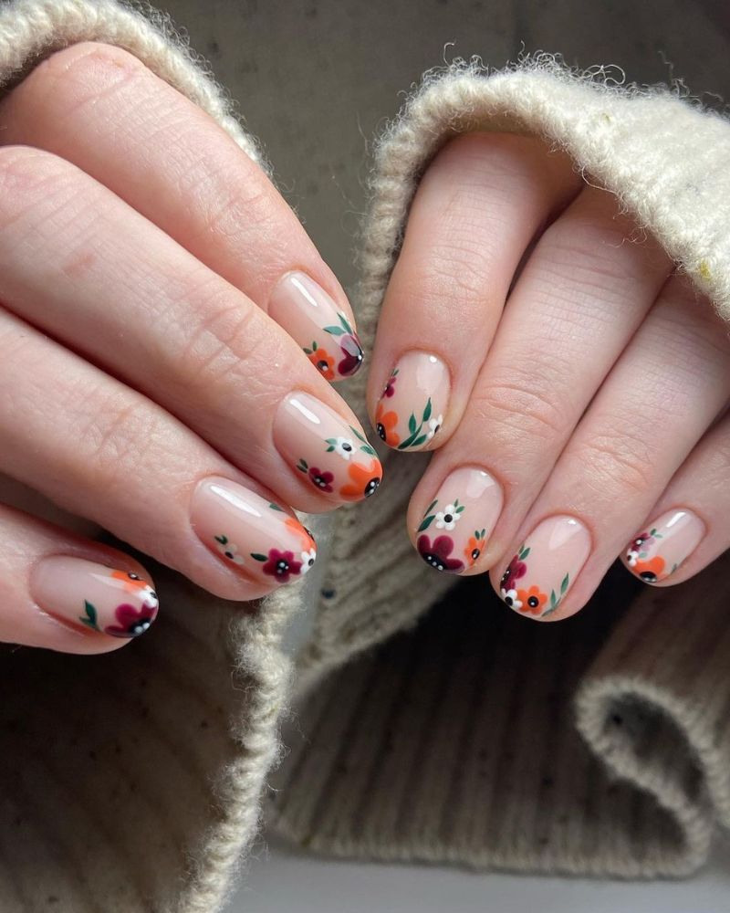 cute fall nail art with flowers and seasonal colors