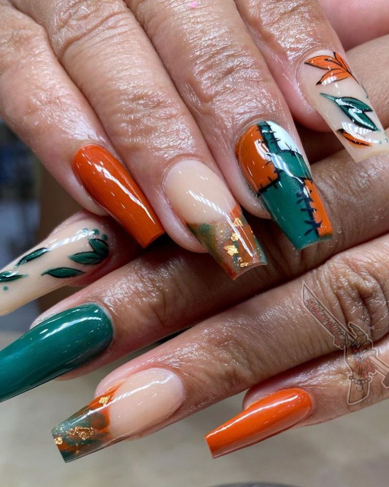 spooky season nails on long coffin shape, orange and emerald green colors