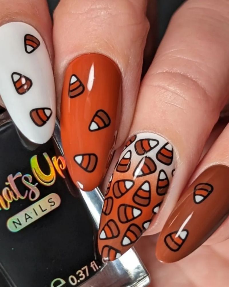 fall nail art with corncandy on white, brown and burnt orange base