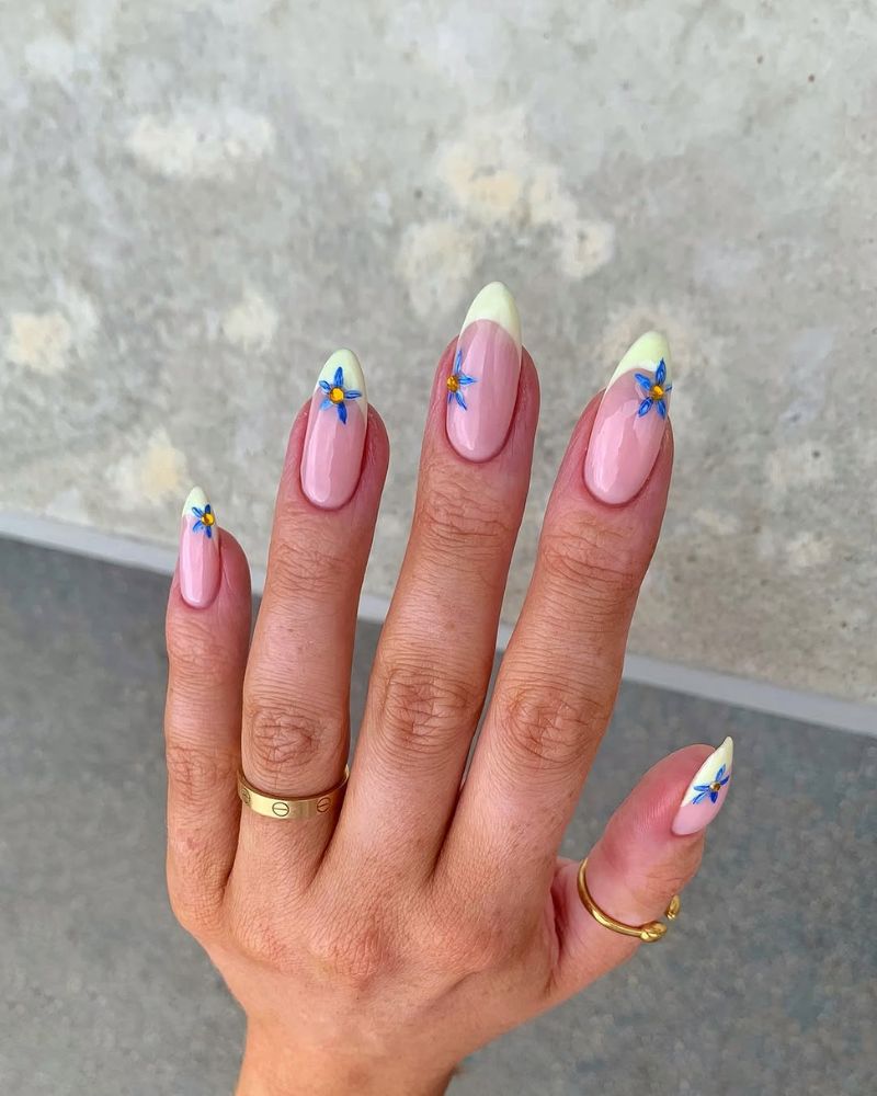 pastel yellow tips, blue flower nail art