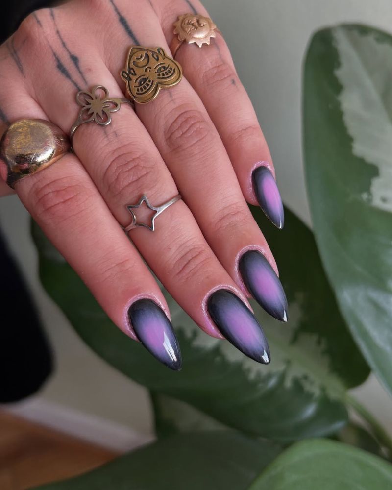 long stiletto black purple nails with violet aura nail art design