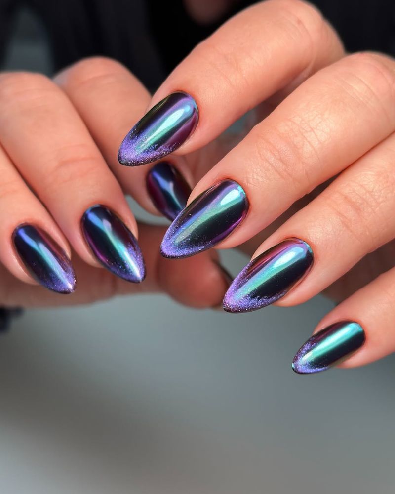 black purple nails with galaxy chrome finish on almond shape