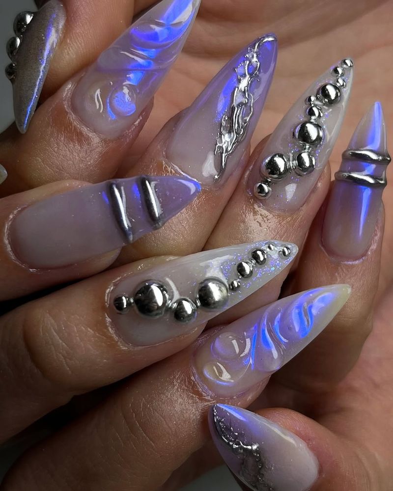 long stiletto nails with lavender chrome and silver nail art