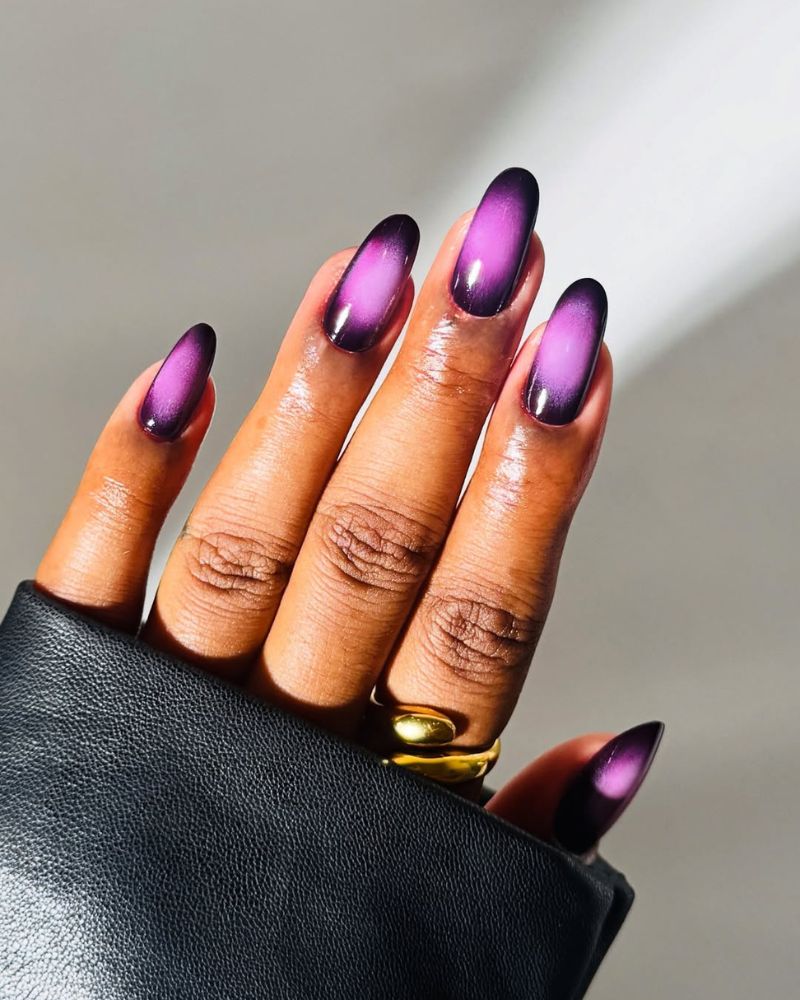 black purple base with deep violet aura nail design