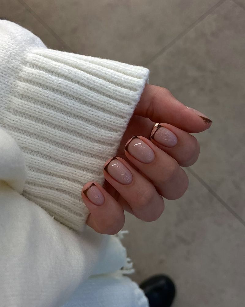chocolate brown thin french tip with a glossy nude base on a square shape