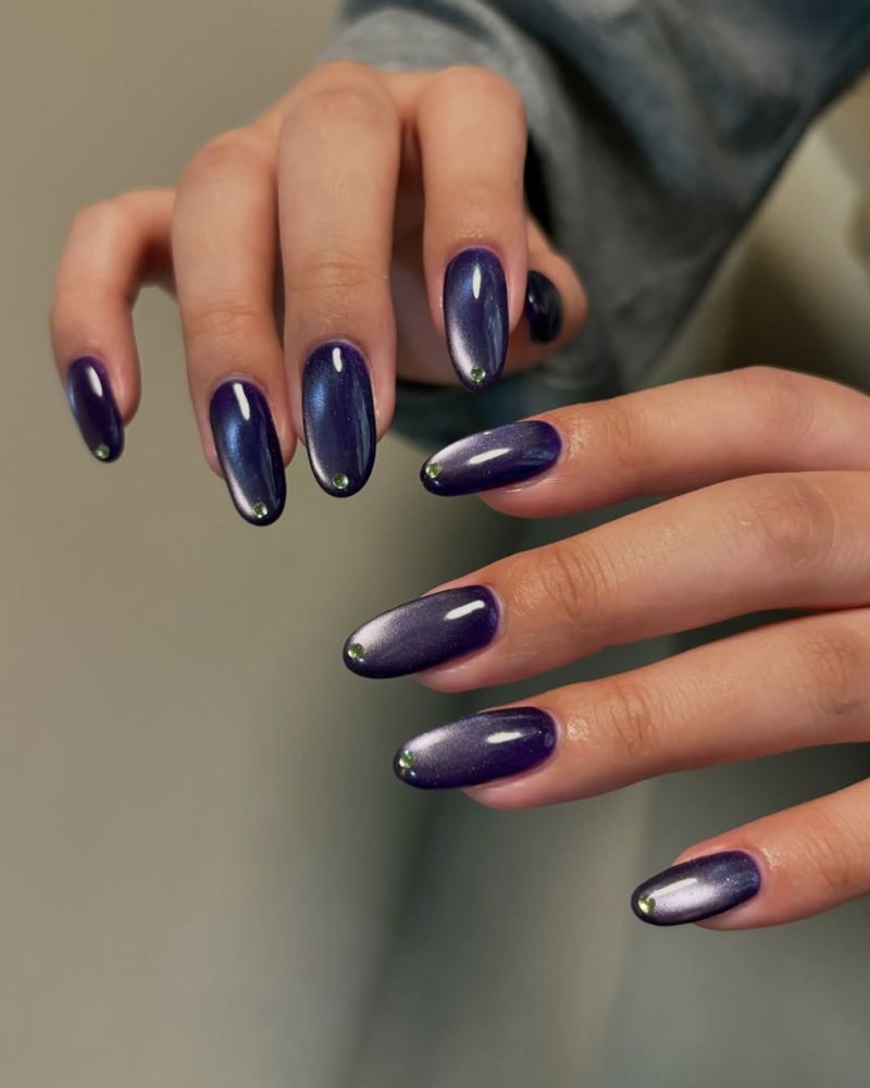 dark purple cat eye manicure