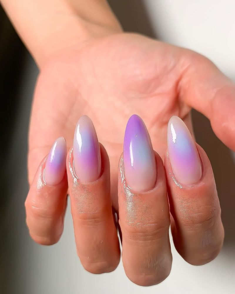 clean, nude stiletto nails with lavender aura nail art
