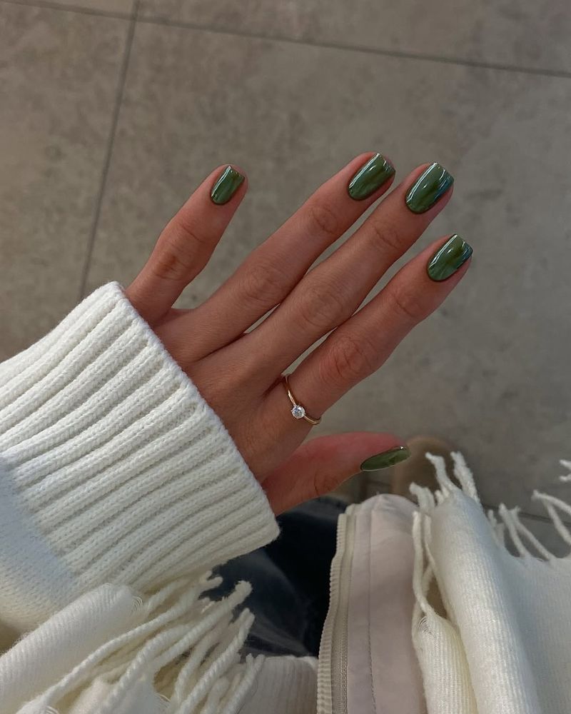 olive green nails with chrome finish on a short square shape