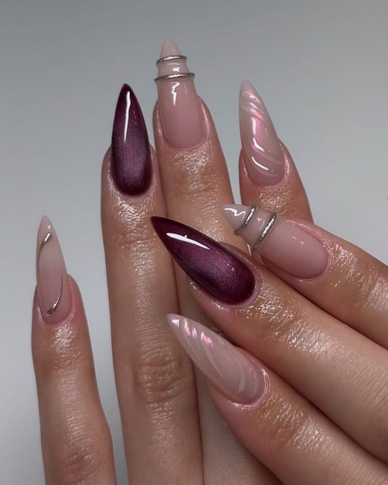 long sharp stiletto nails with chrome and plum nail art