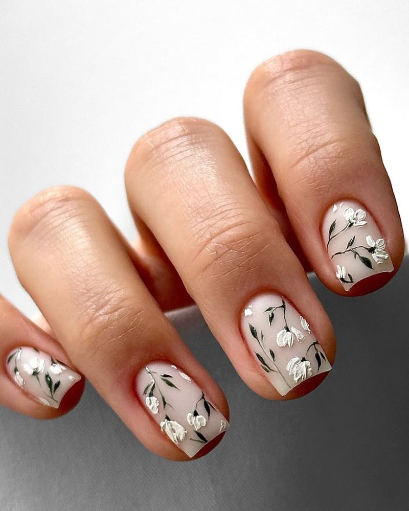 square milky white nails with snowdrop design