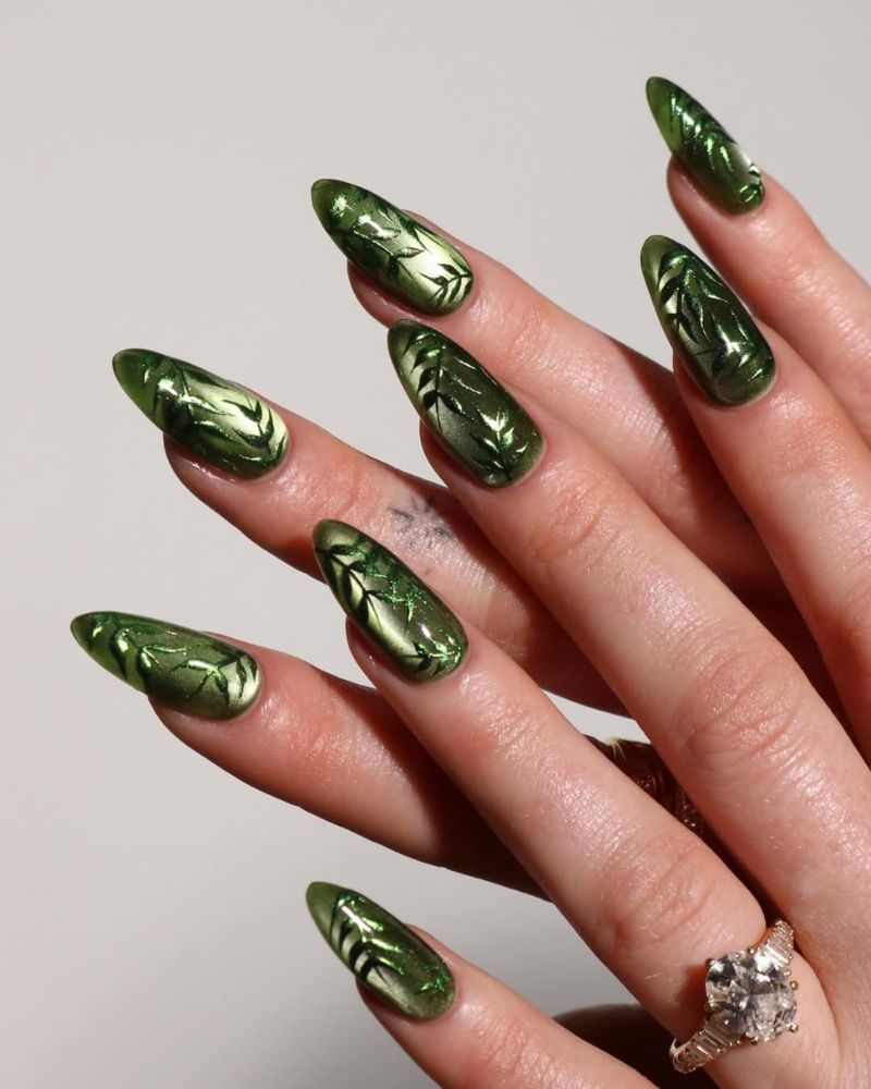 green cat eye springtime nail designs with leaf nail art