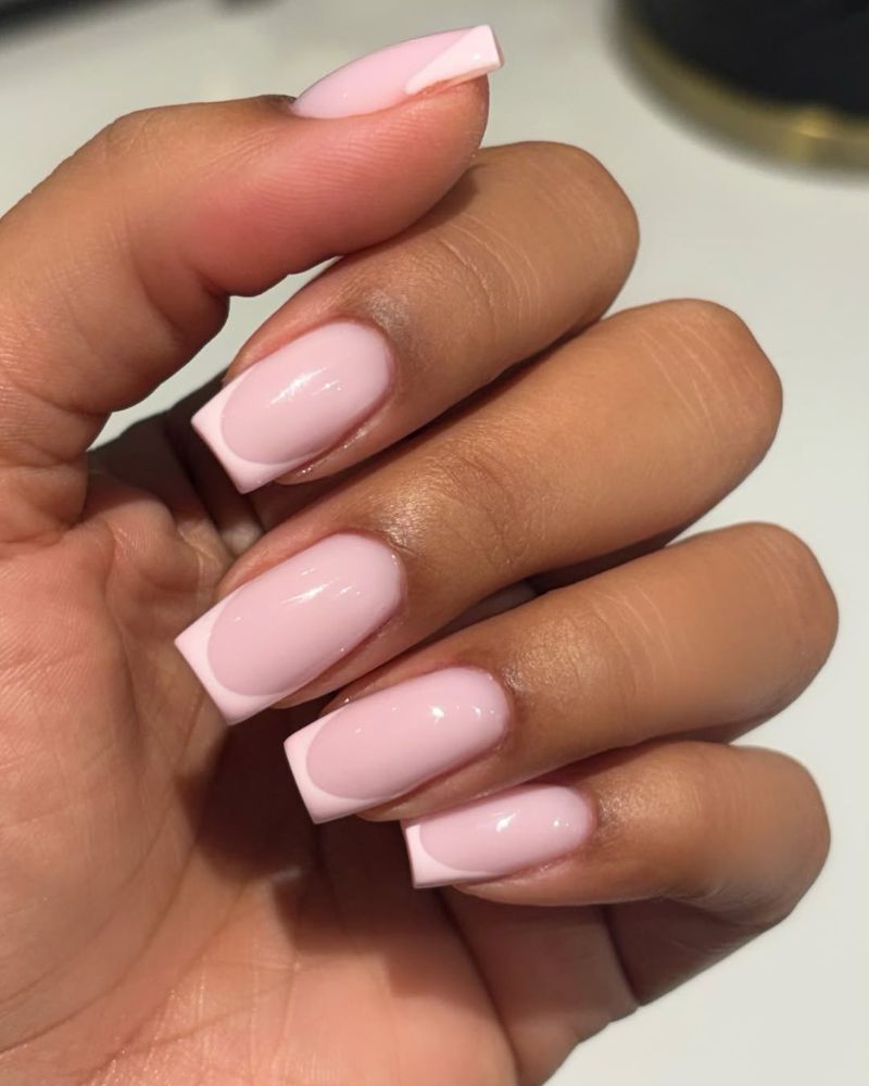 baby pink base with clean white french tips on short square nails