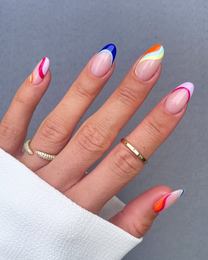 colorful swirl french tip nails with cobalt blue lilac and coral multicolor variations on almond nails