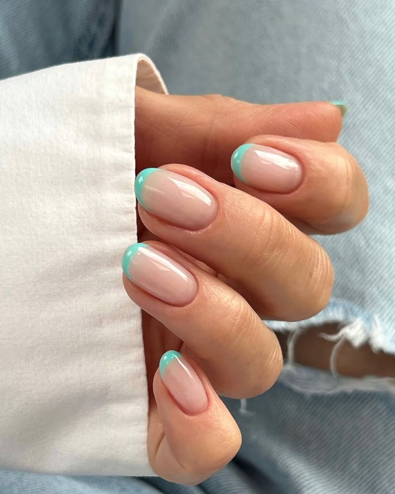 simple summer french nails in mint on short oval nails clean and minimal