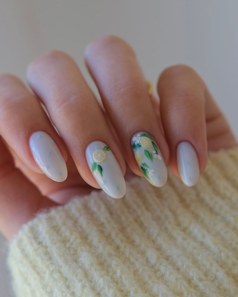 simple summer manicure with lemon nail art on milky white base
