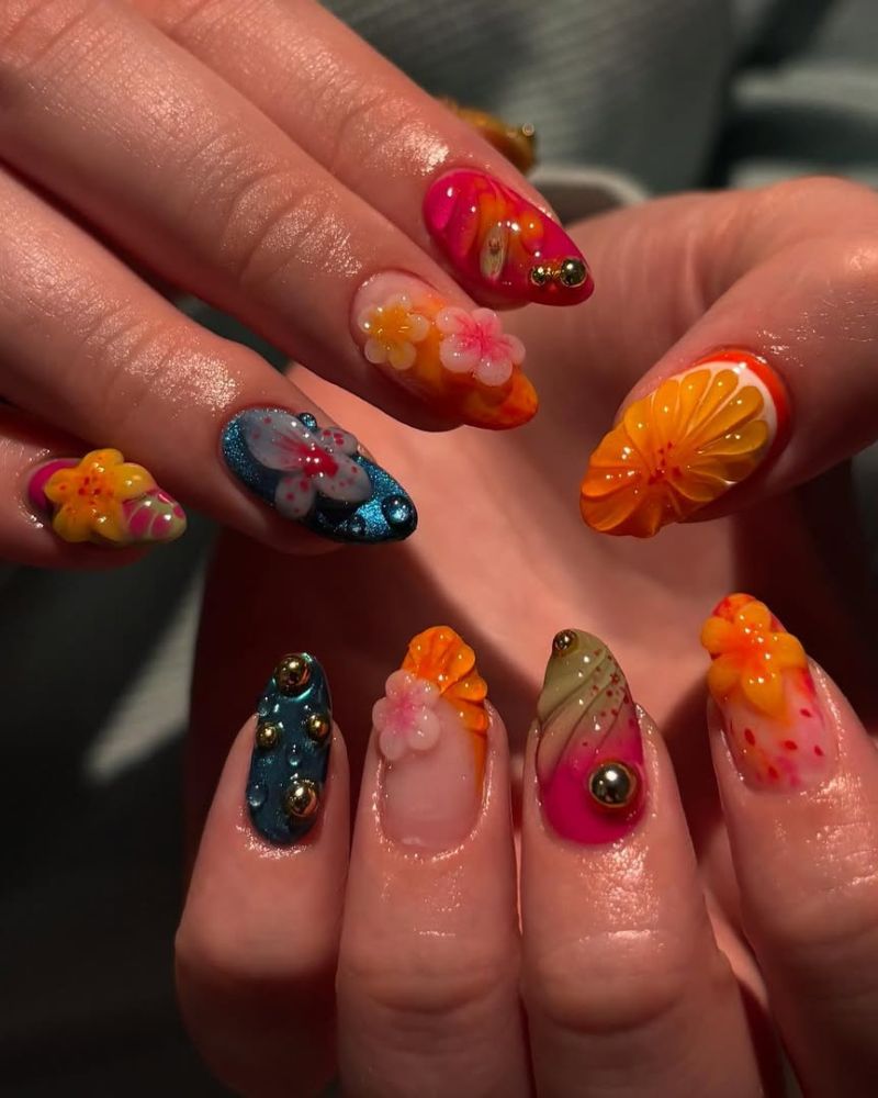 tropical summertime nail art with 3D hibiscus flowers, teal glitter, and sculpted citrus slice
