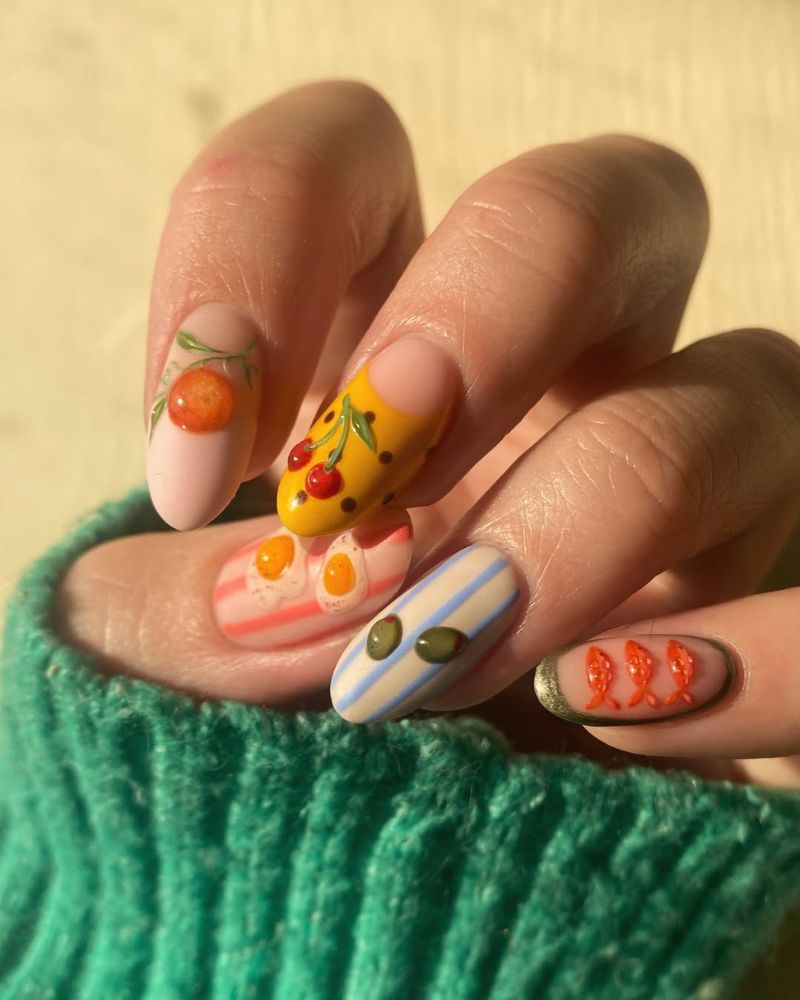 food themed nail art with painted oranges cherries fried eggs 3D olives and small fish