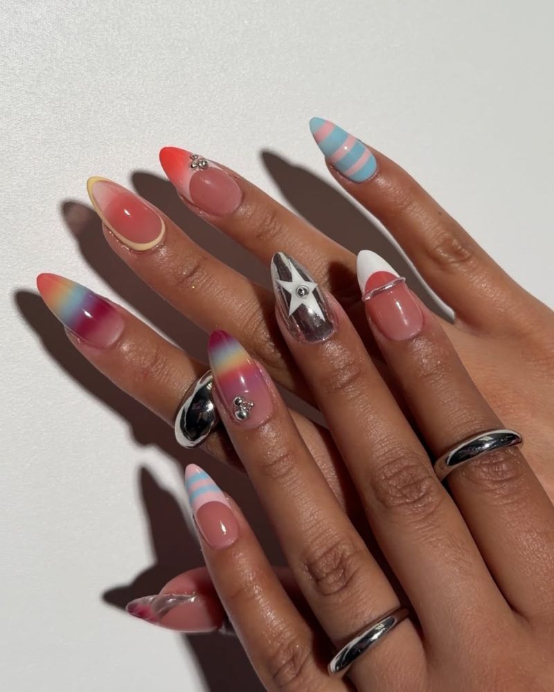 eclectic summer nail art with rainbow ombre chrome star and blue stripe nails