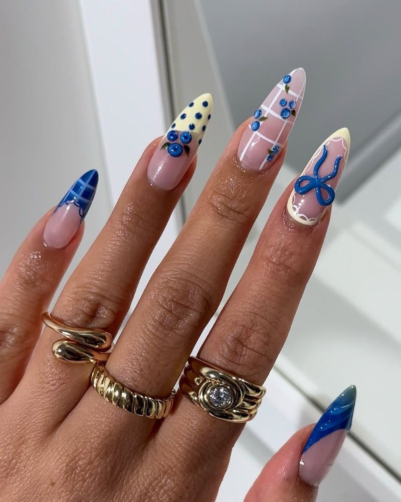 blue nail art set with plaid french tips 3D blueberry clusters and bow detail
