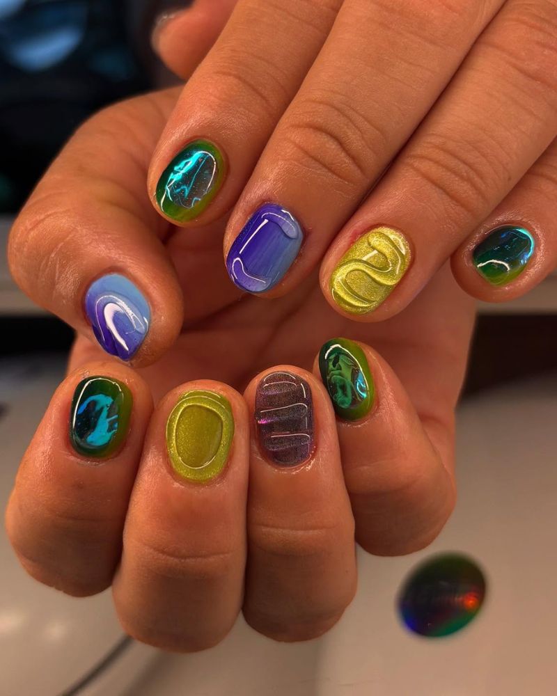 short square nails with jewel tone chrome swirl each nail a different color
