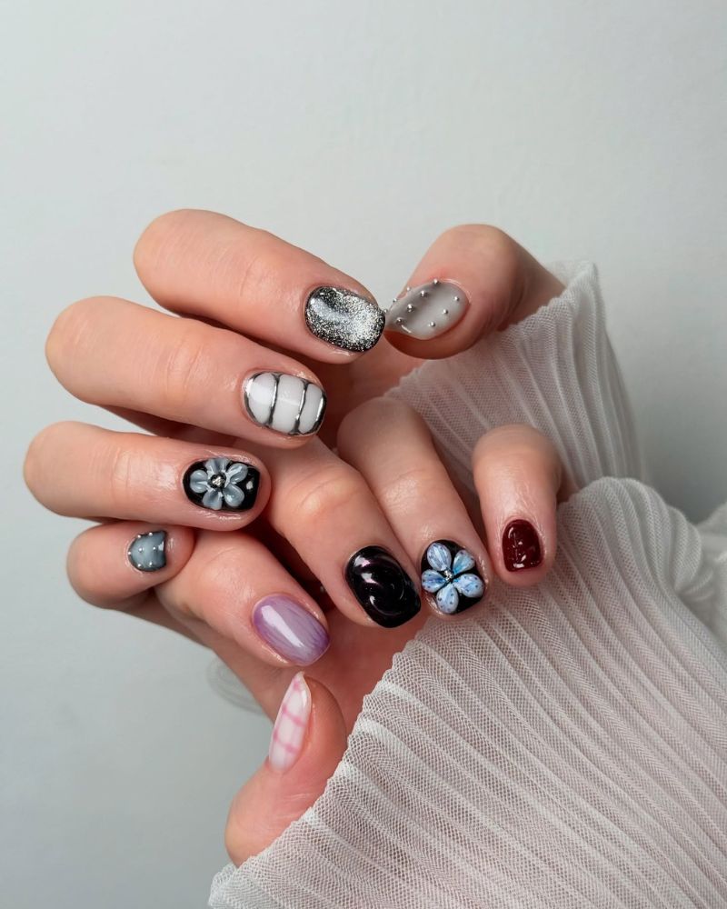 moody dark nail set with black burgundy grey and blue 3D flower accents