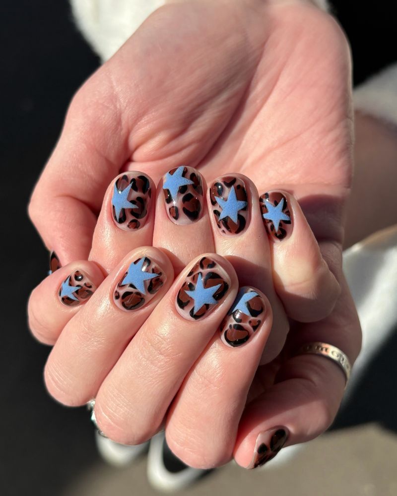 tortoiseshell leopard print short nails with matte blue star on each nail