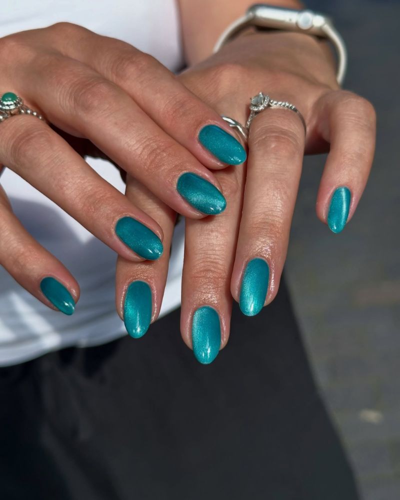 deep teal jewel tone cat eye shimmer almond nails