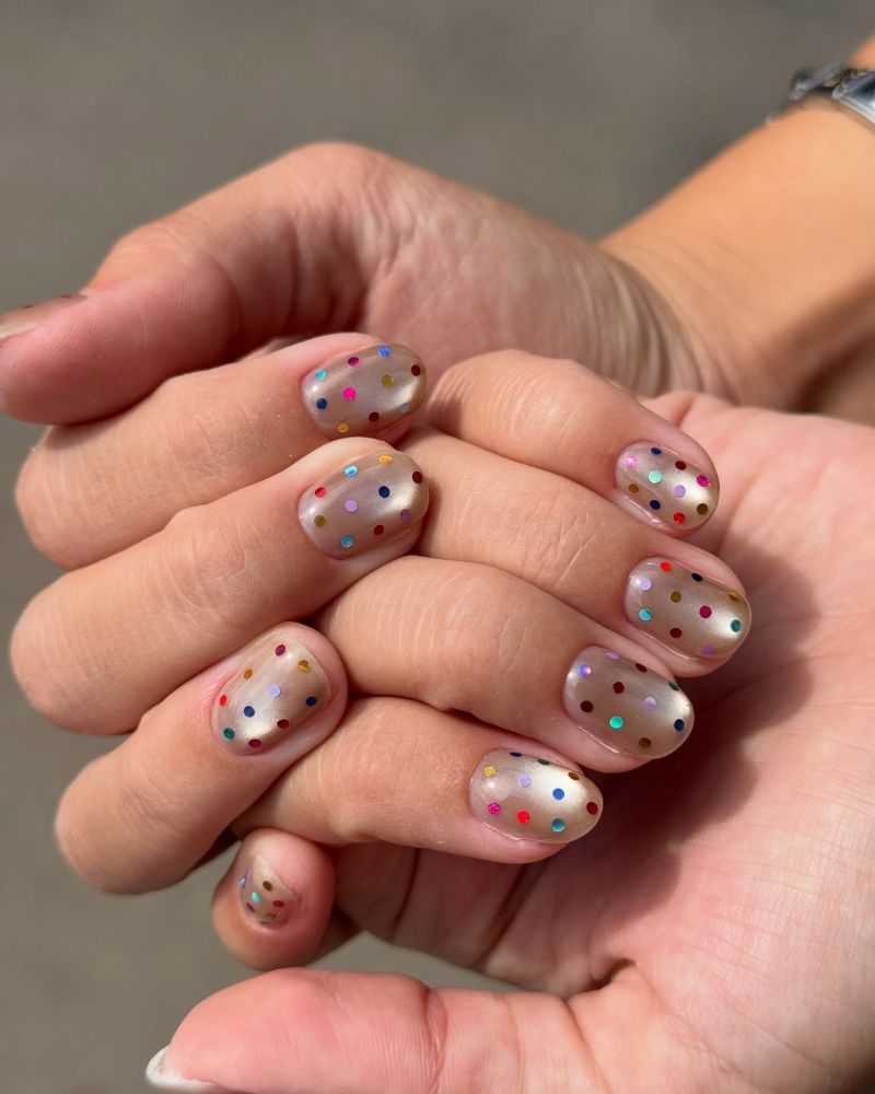 basic back to school nails champagne shimmer with multicolor confetti dots
