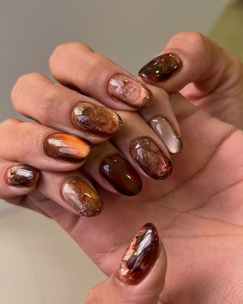 fall jelly nail mixed set in warm autumn tones with tortoiseshell and marble swirls