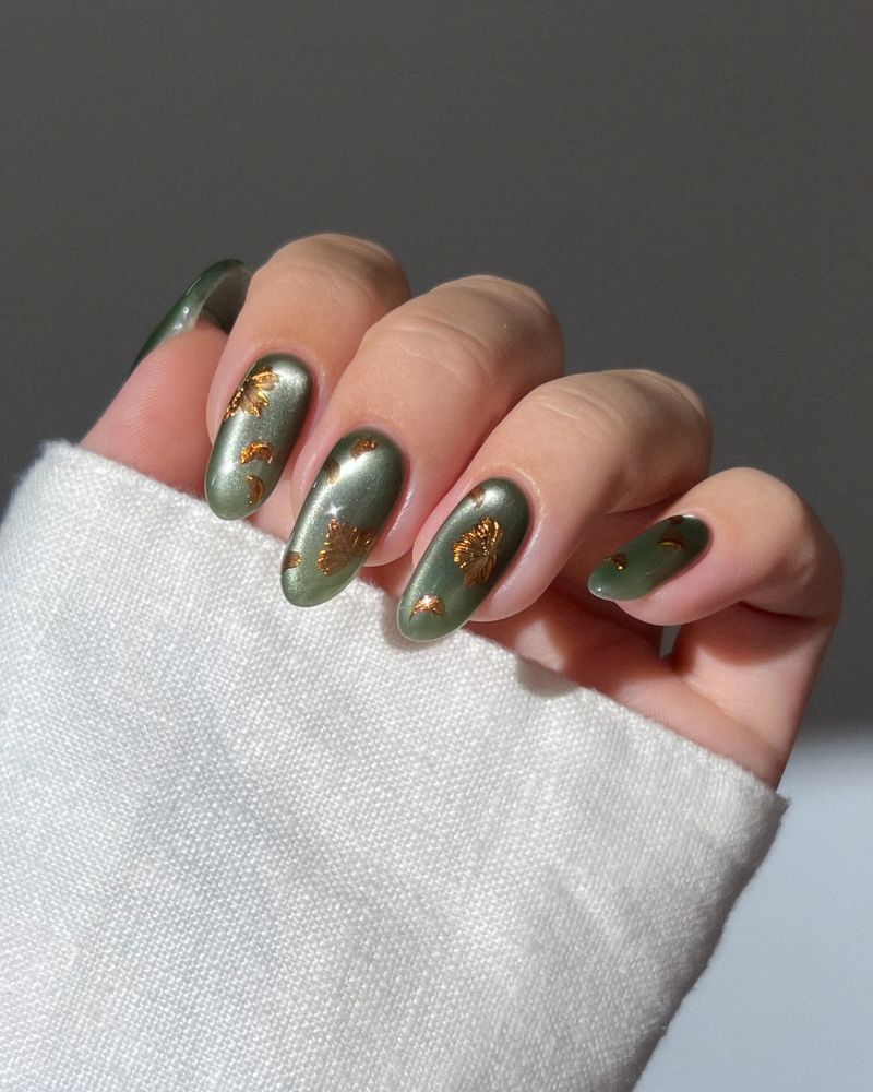 muted olive jelly nails with scattered gold botanical accents