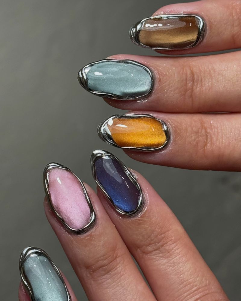 fall jelly nail art with 3d silver chrome borders framing mixed cat eye colors