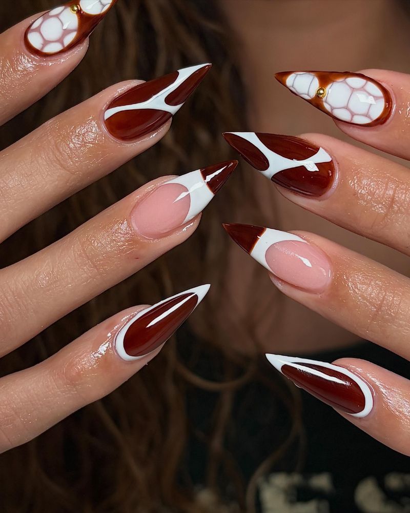 cinnamon dark stiletto nails with white arabesque geometric art and croco texture