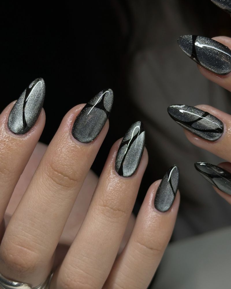 charcoal gunmetal jelly nails with curved black abstract lines