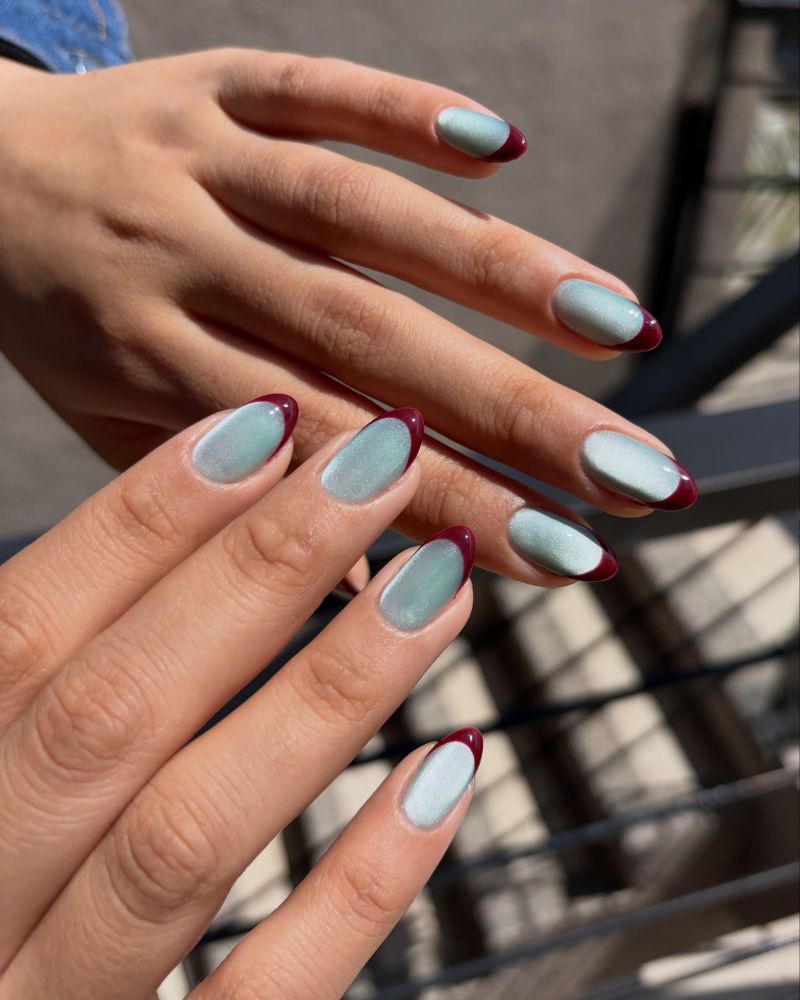 fall jelly nails sheer glaciar blue base with deep burgundy french tips