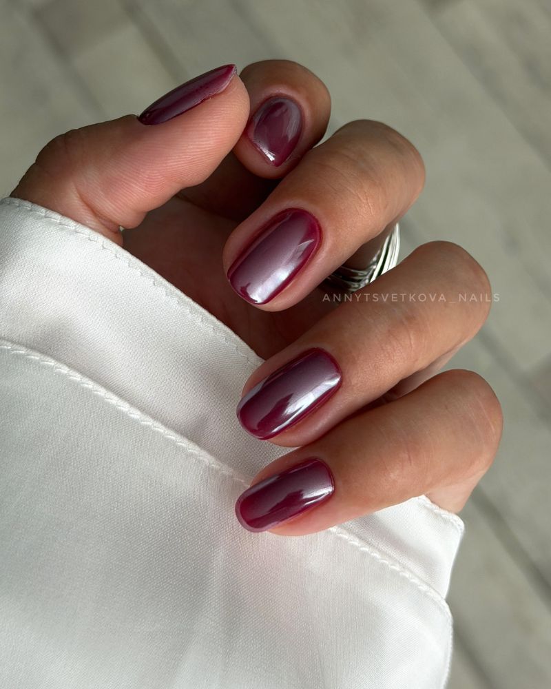 dark cherry red short oval nails with pearl satin shimmer finish