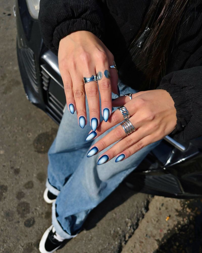 deep navy stiletto nails with icy chrome satin aura center silver rings