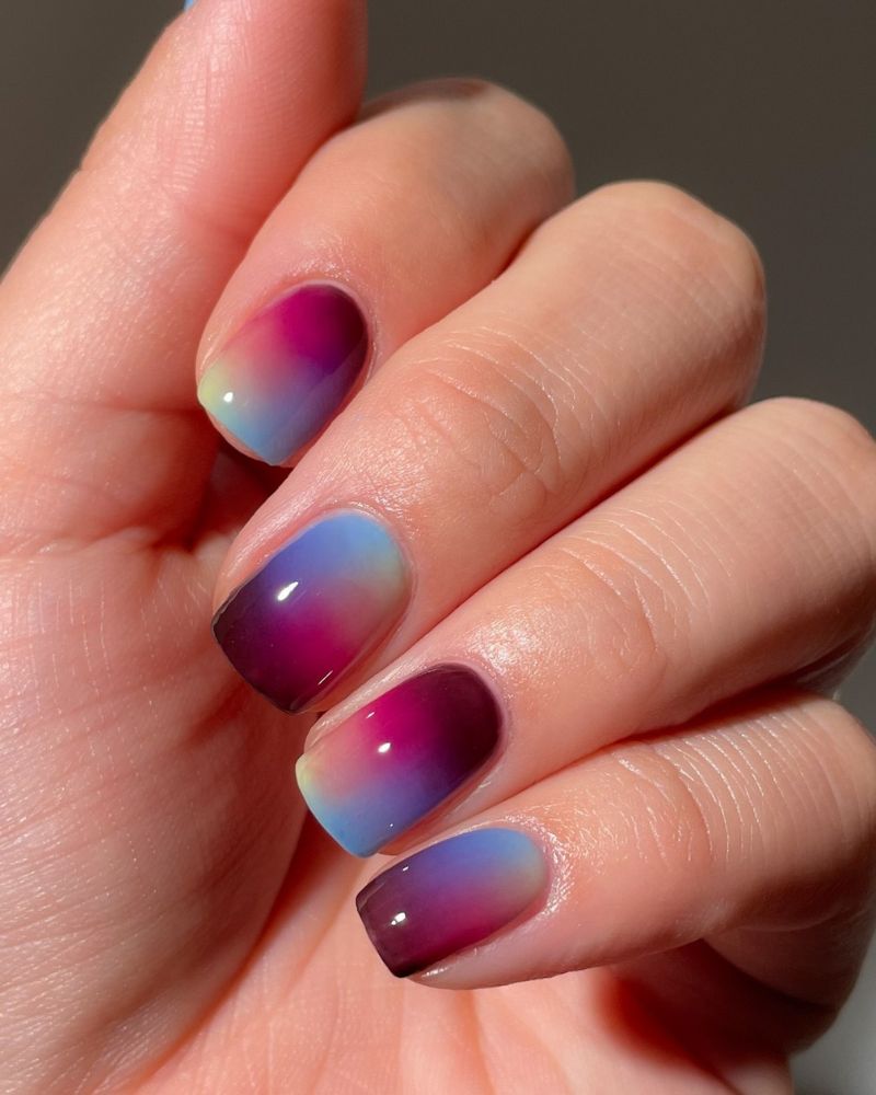 multi-color aura gradient short square nails in magenta icy blue and dark plum