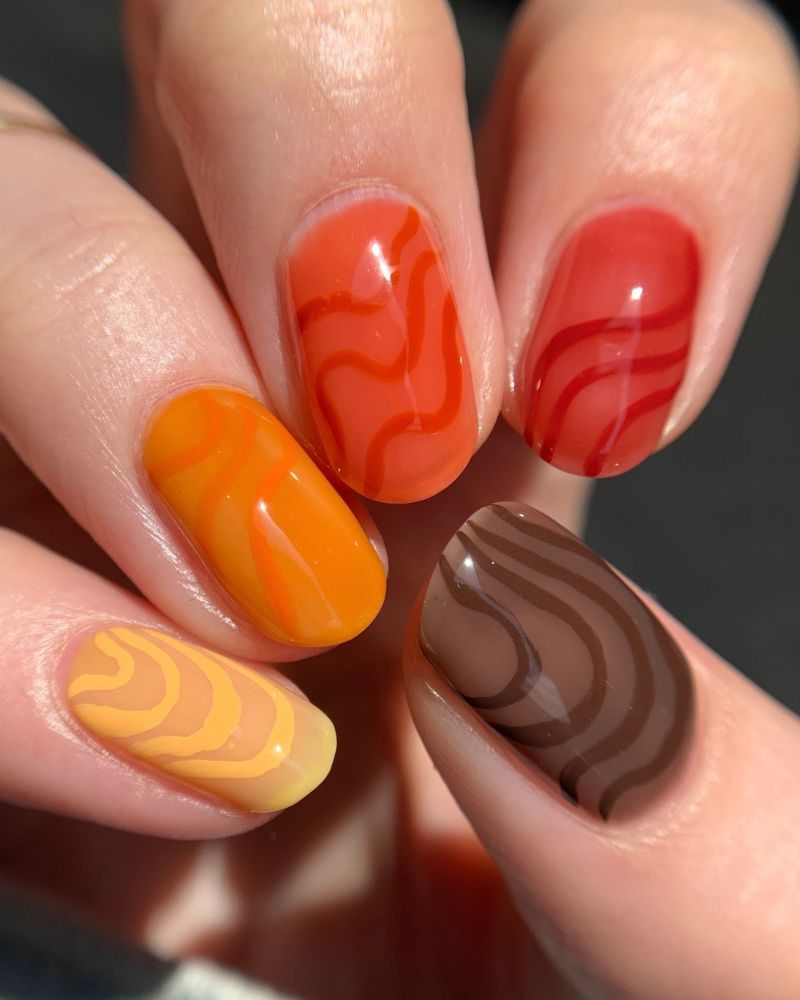 fall jelly nails mixed autumn palette with tone-on-tone swirls