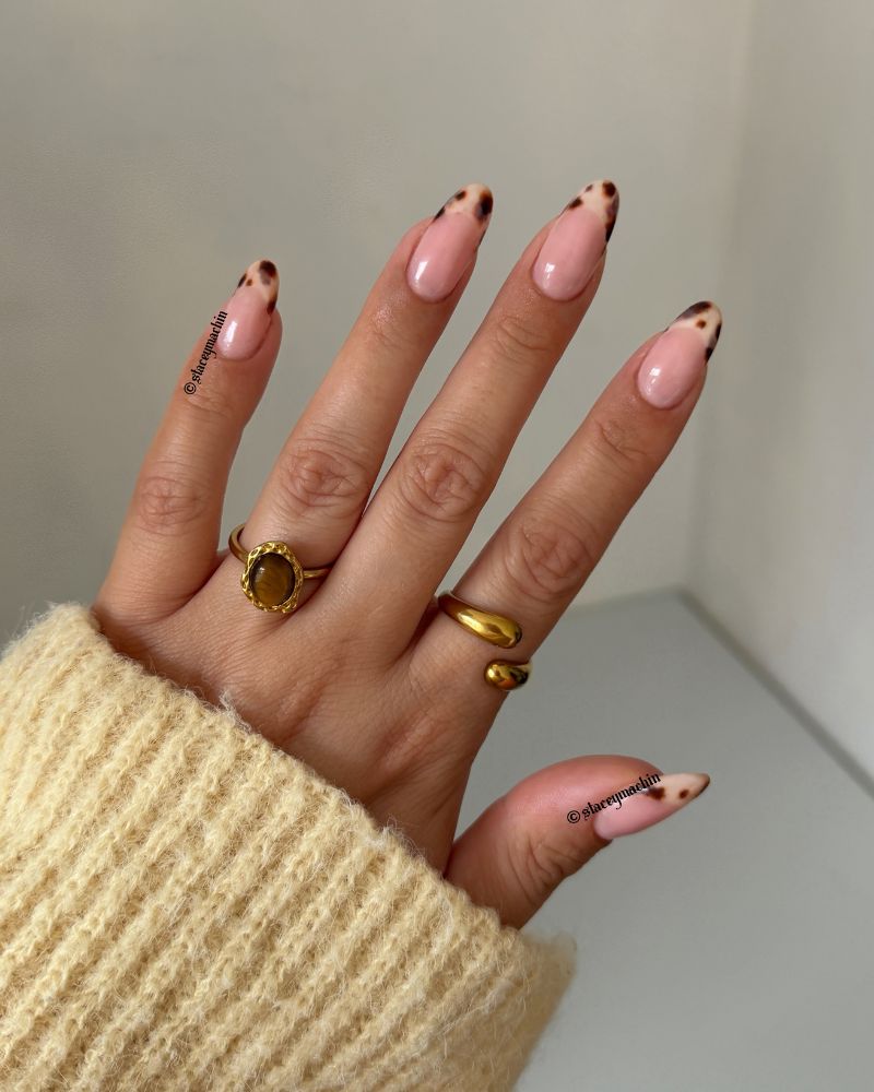 sheer pink almond nails with dark tortoiseshell micro dot tip detail cream knit