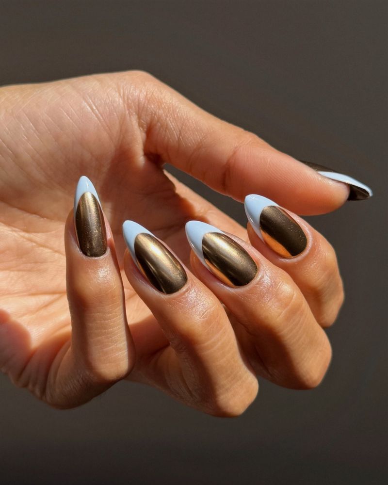 bronze chocolate chrome nails with sky blue french tip border almond shape