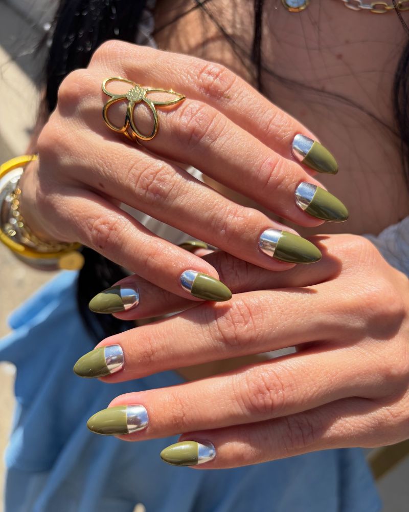 olive green almond nails with silver chrome half moon accent two hands
